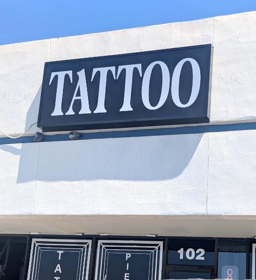 Golden Cobra Tattoos and Piercings